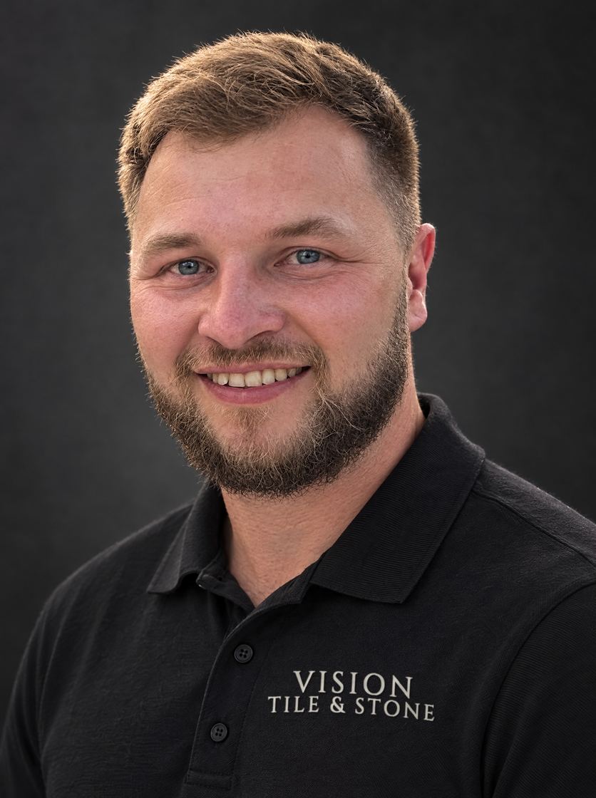 Mark, who runs Vision Tile & Stone, in a branded polo shirt